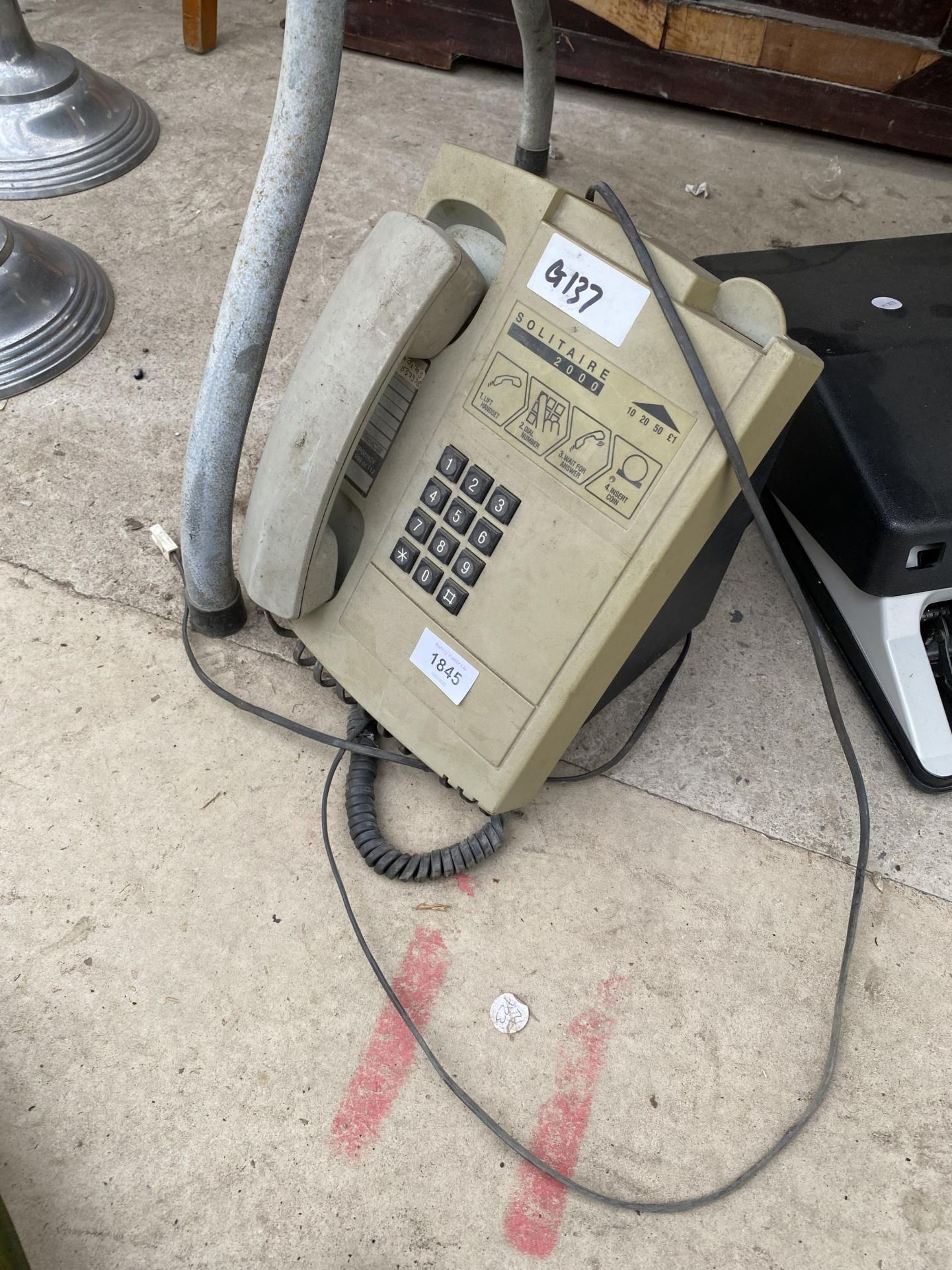A SOLITAIRE 2000 PAY PHONE