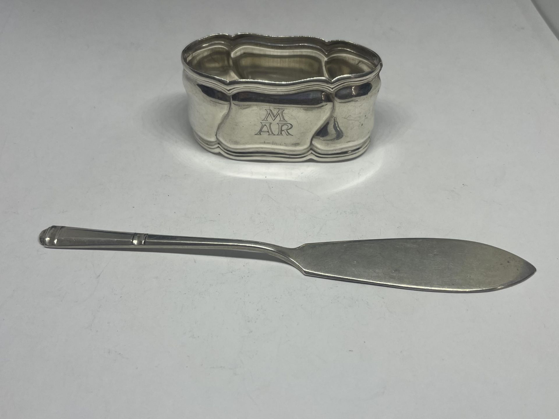 A HALLMARKED SHEFFIELD KNIFE AND A SILVER NAPKIN RING