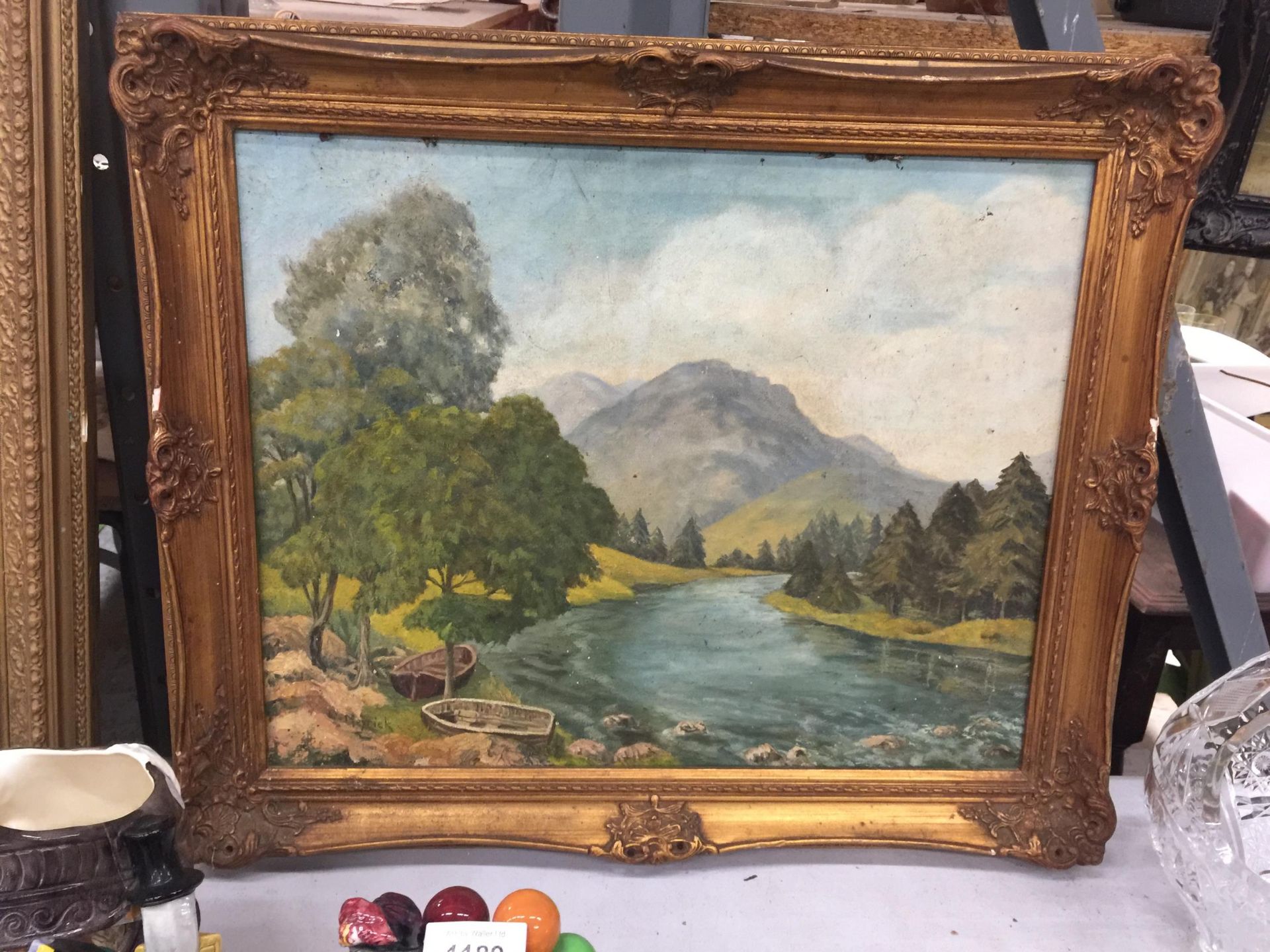 AN OIL ON CANVAS PAINTING OF A RIVER AND MOUNTAIN SCENE, FRAMED