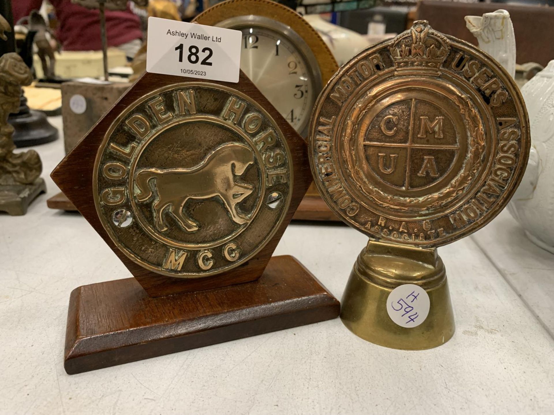 TWO BRASS MOTORING BADGES ON PLINTHS, 'GOLDEN HORSE MCC' AND R.A.C. COMMERCIAL MOTOR USERS