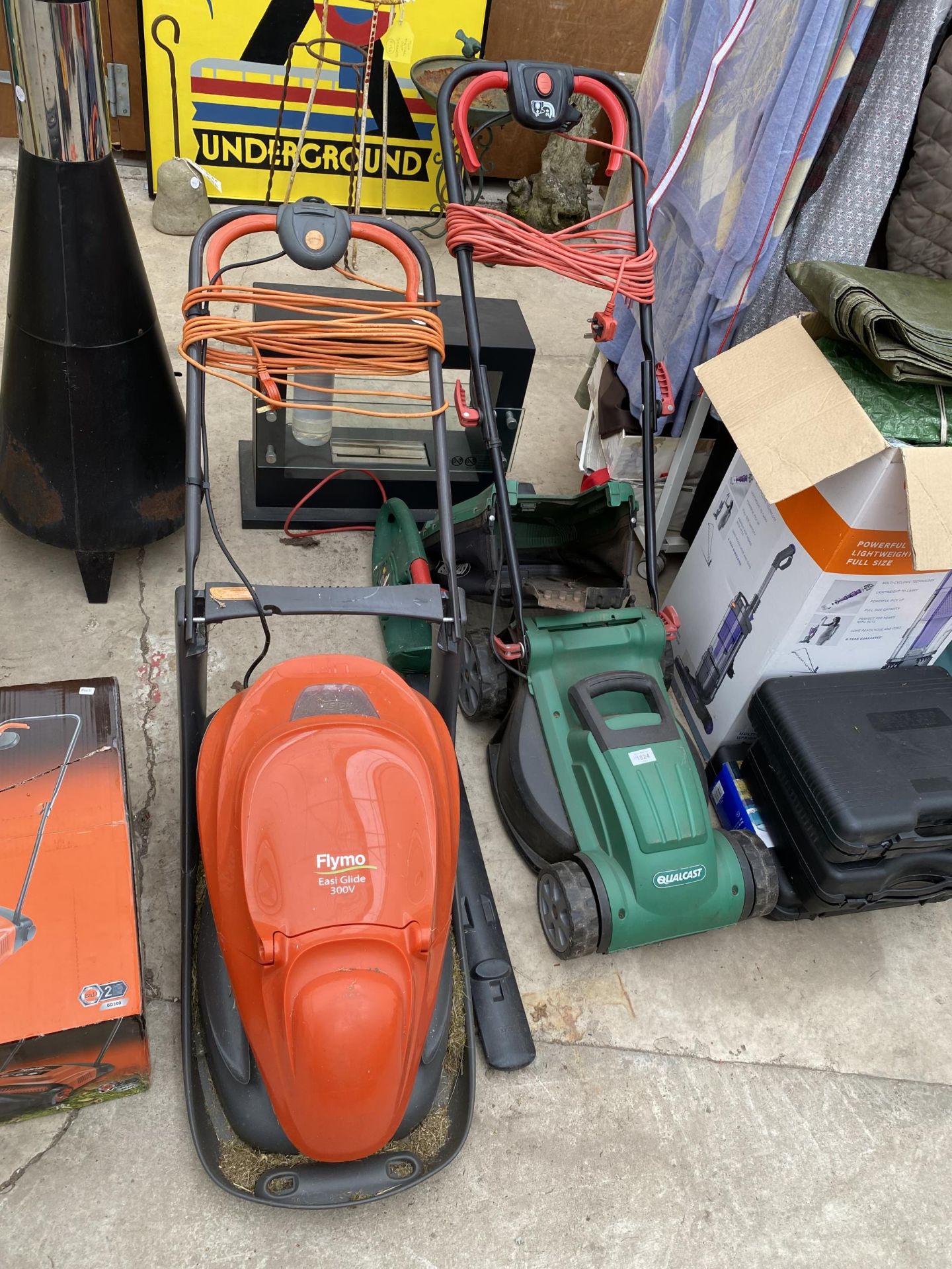 A QUALCAST ELECTRIC LAWN MOWER, A FLYMO ELECTRIC EASIGLIDE MOWER AND AN ELECTRIC HEDGE TRIMMER