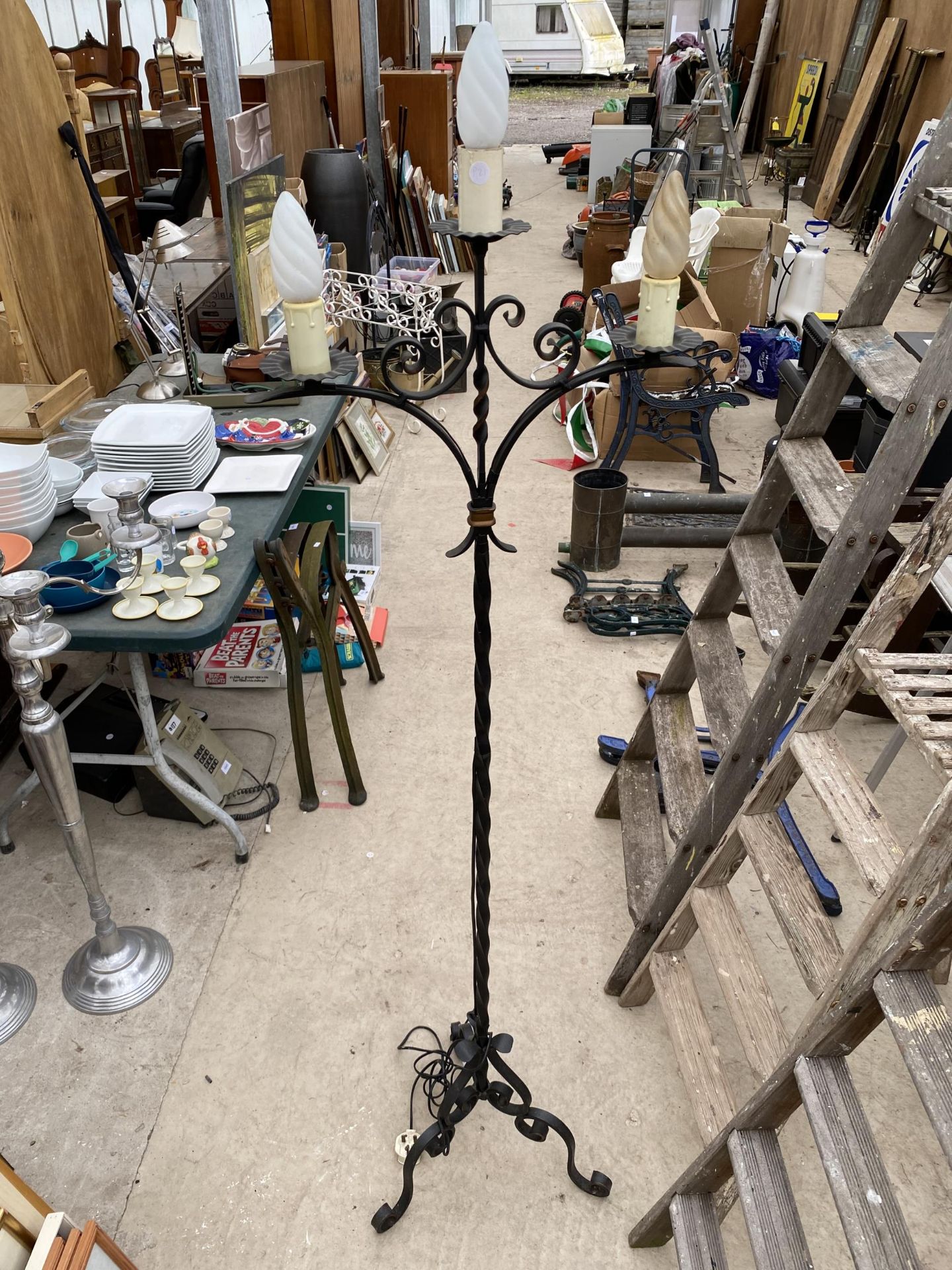 A DECORATIVE METAL THREE BRANCH FLOOR LAMP