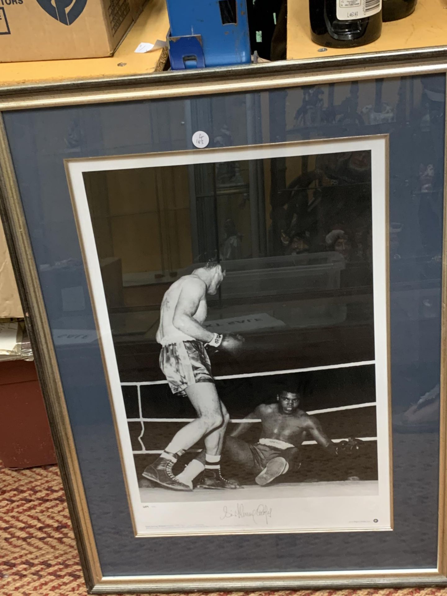 A SIGNED AND FRAMED MUHAMMED ALI & HENRY COOPER PHOTOGRAPH WITH CERTIFICATE