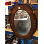 A VINTAGE OAK FRAMED MIRROR