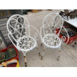 A PAIR OF DECORATIVE WHITE CAST ALLOY BISTRO CHAIRS