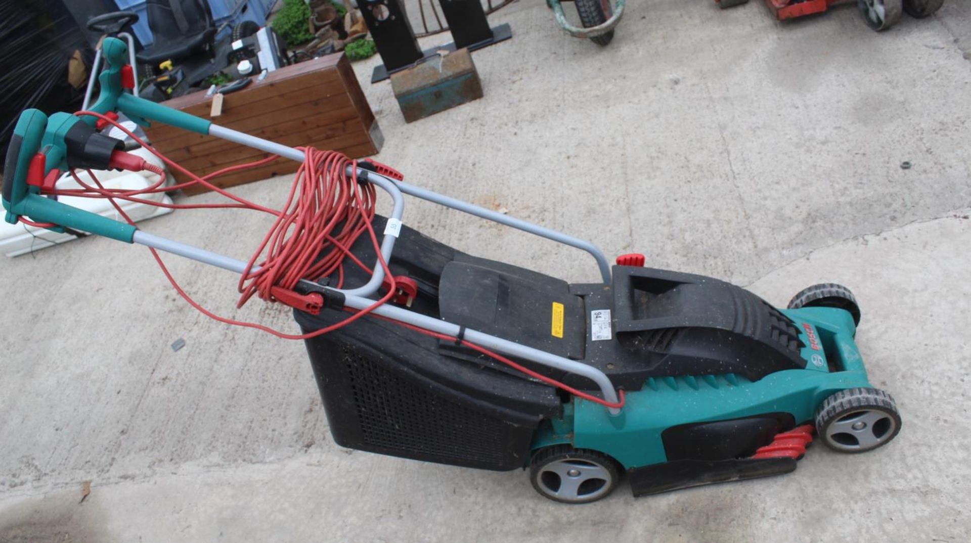AN ELECTRIC BOSCH ROTARY 34 LAWNMOWER WITH GRASS BOX BELIEVED IN WORKING ORDER BUT NO WARRANTY GIVEN