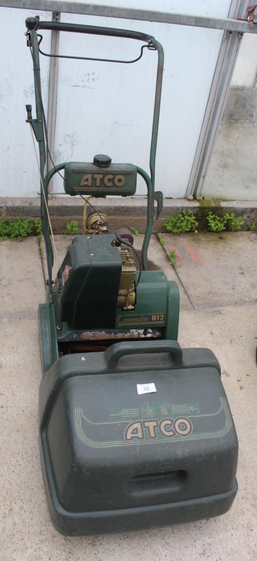 A PETROL CYLINDER COMMORE B12 ATCO LAWNMOWER COMPLETE WITH GRASS BOX AND MANUAL BELIEVED IN