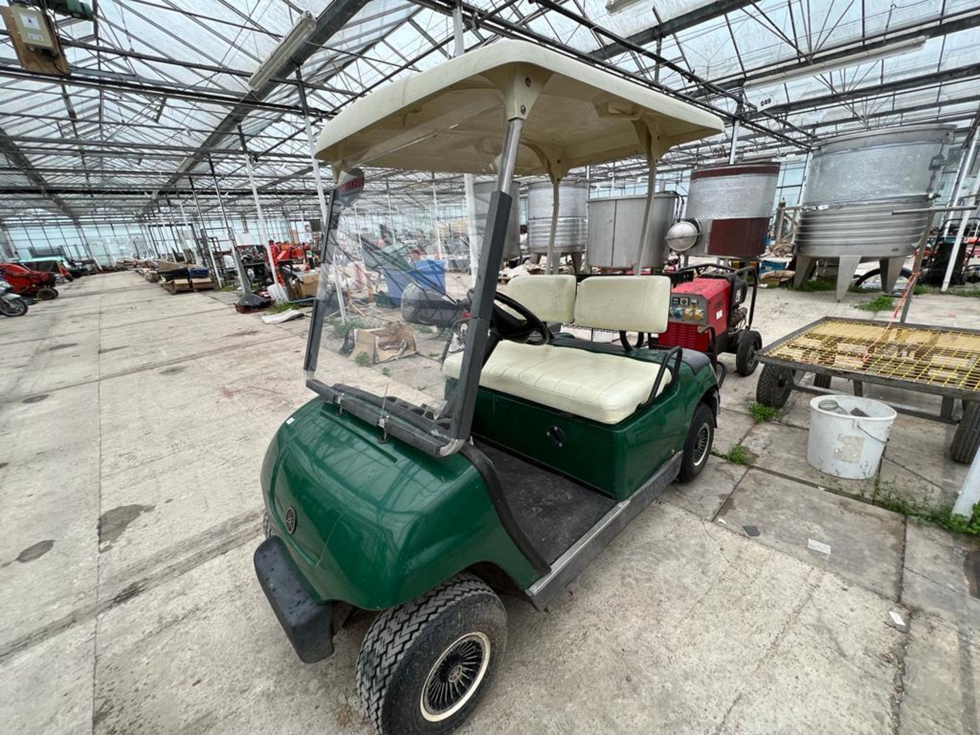 A GOLF BUGGY WITH CHARGER BUT NO BATTERIES IT WAS WORKING WHEN LAST USED BUT NO WARRATY NO VAT