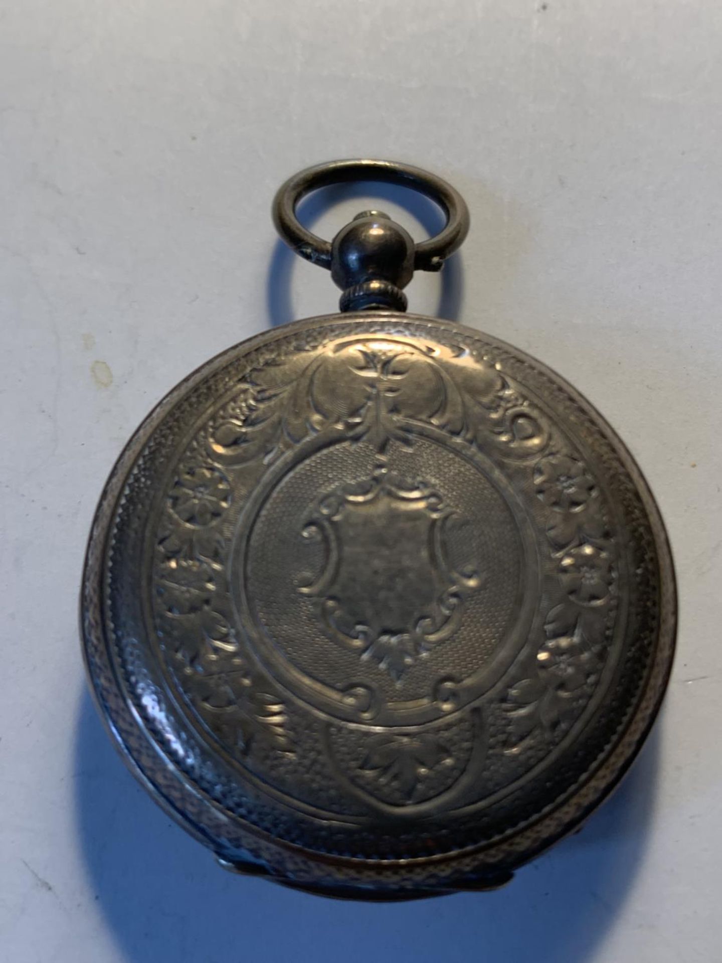 AN 800 SILVER POCKET WATCH WITH SUB DIAL, DECORATIVE WHITE ENAMEL FACE, ROMAN NUMERALS AND A KEY - Image 3 of 4