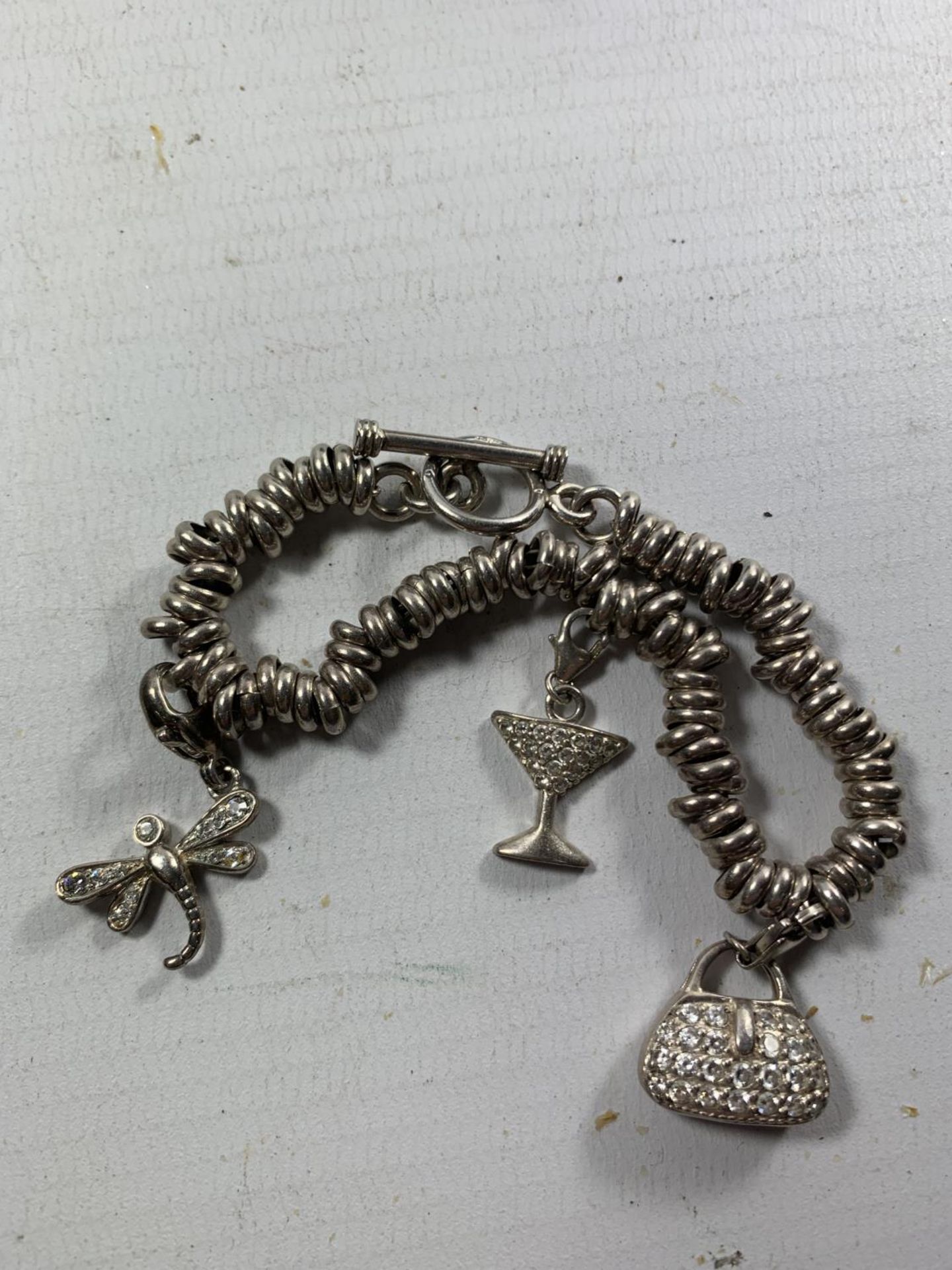 A SILVER SWEETY BRACELET WITH THREE CHARMS - Image 2 of 2