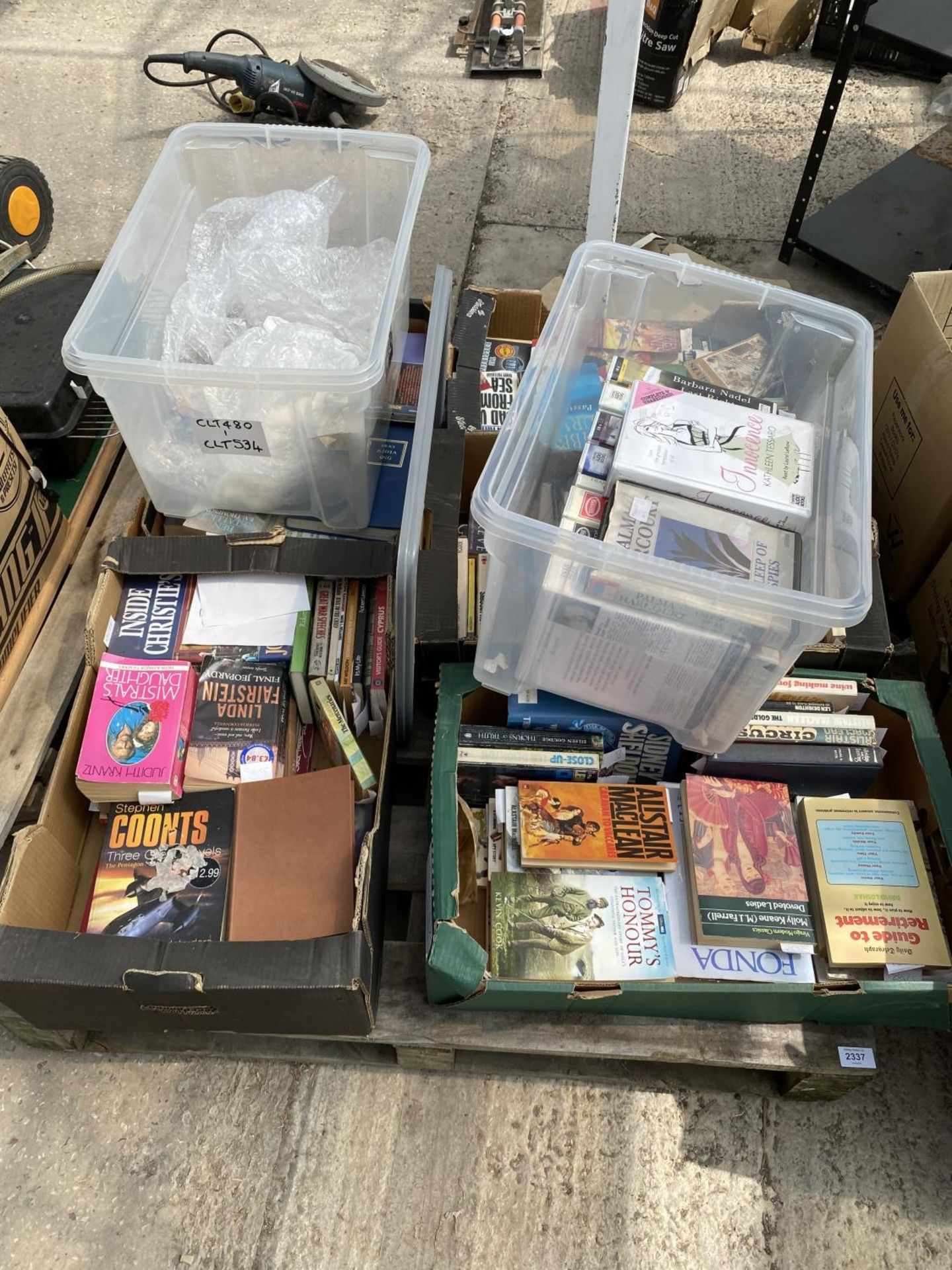 A LARGE ASSORTMENT OF BOOKS