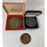* A LARGE CASED PORTUGUESE BRONZE MEDAL AND A LARGE GERMAN BRONZE MEDAL AND A SHAKESPEARE MEDAL (3)