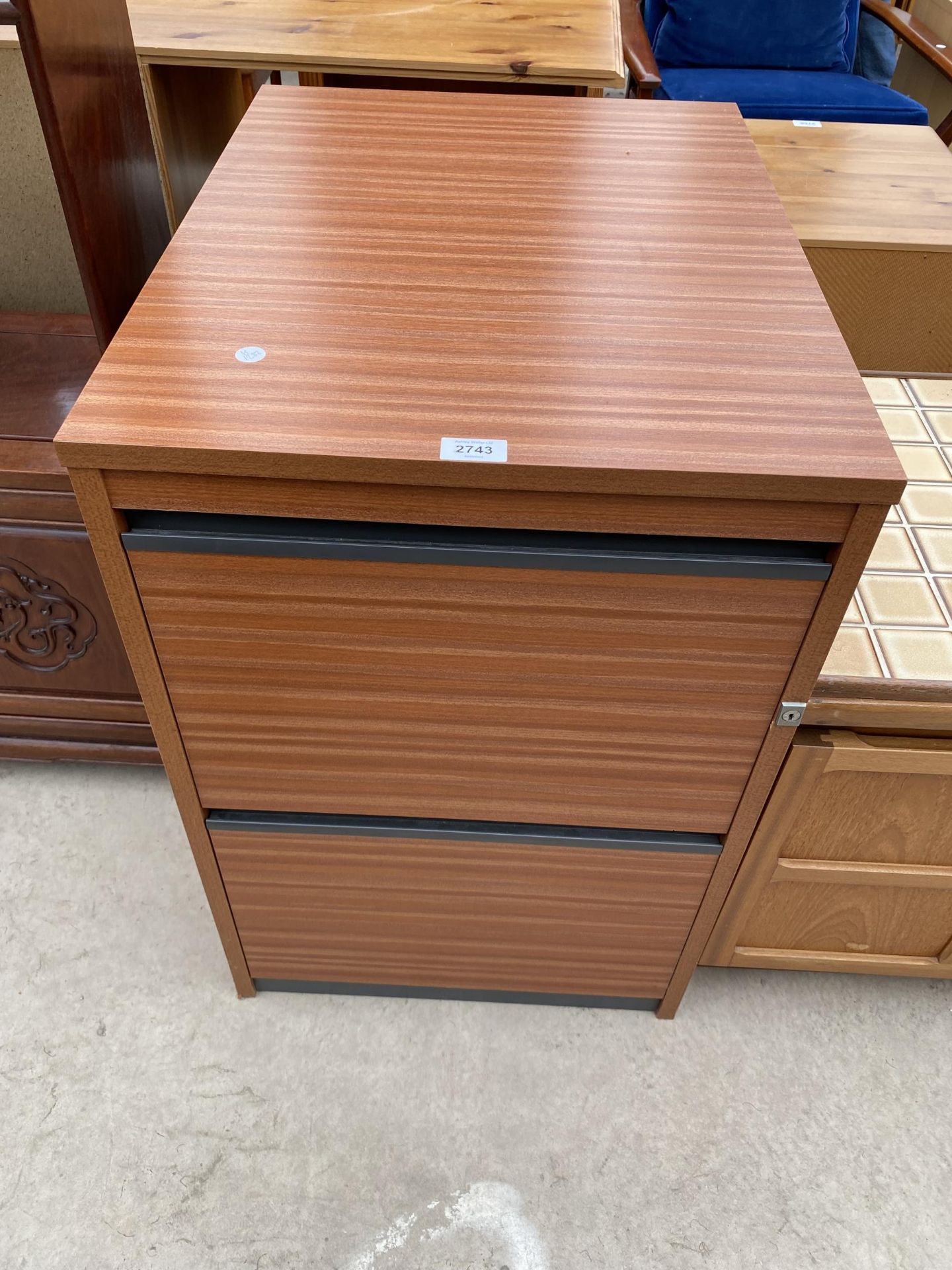 A MODERN TWO DRAWER FILING CABINET