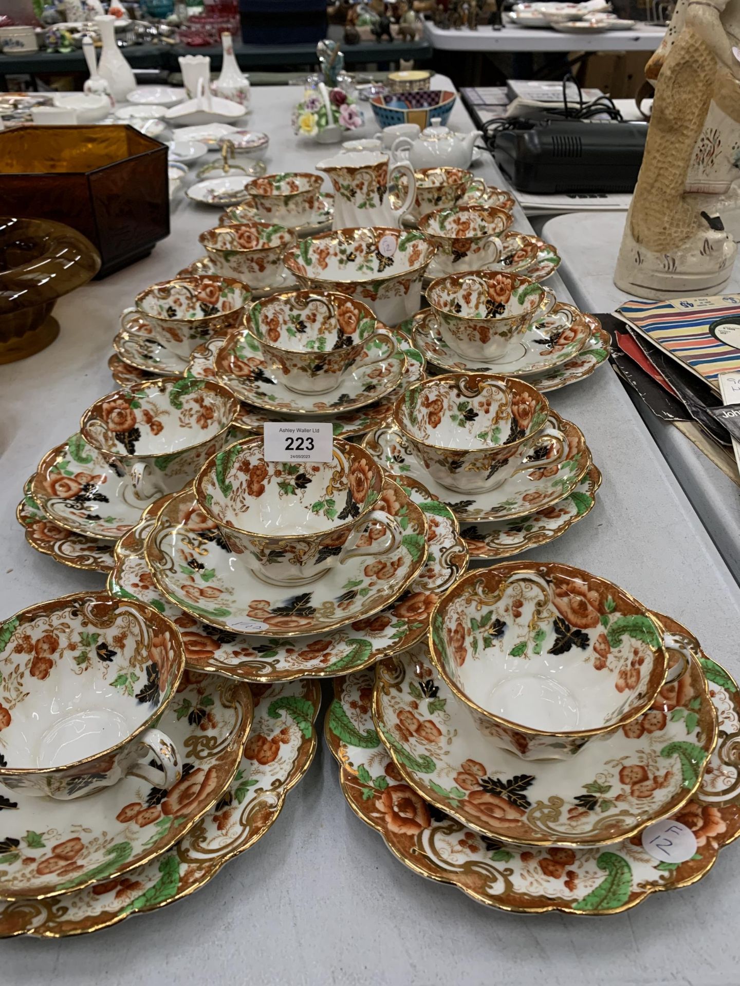 A LARGE QUANTITY OF ROYAL WINDSOR CHINA CUPS, SAUCERS AND SIDE PLATES PLUS A CREAM JUG AND SUGAR
