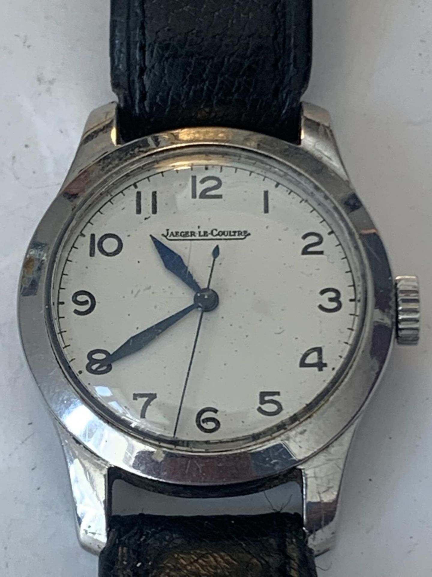 A VINTAGE JAEGER LeCOUTRE WRIST WATCH WITH WHITE FACE AND BLACK LEATHER STRAP POSSIBLY MILITARY. - Image 2 of 4