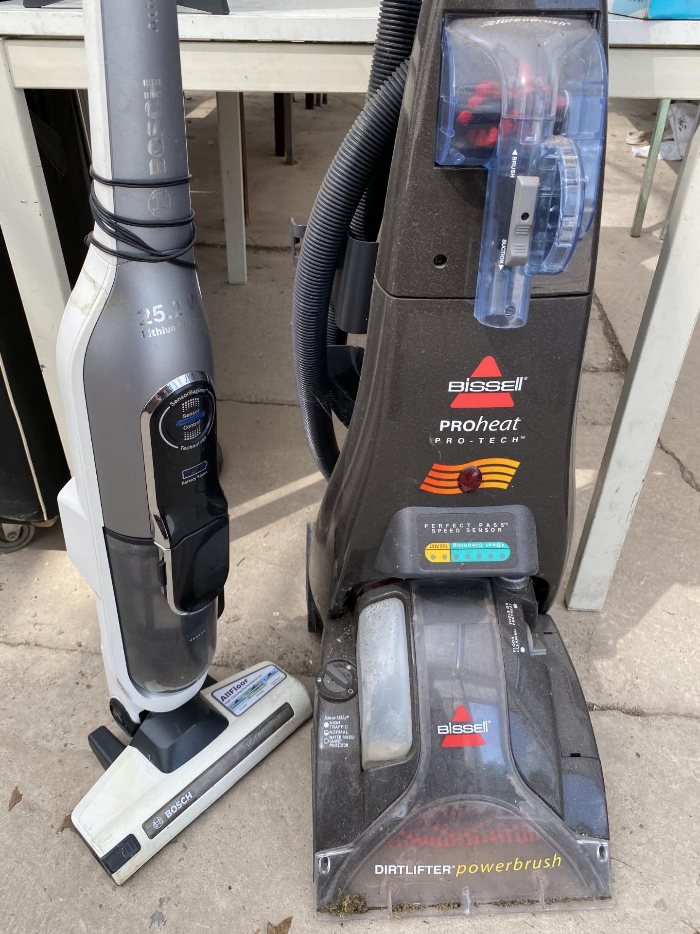 A BISSELL CARPET CLEANER AND A BOSCH STICK VACUUM - Image 2 of 2