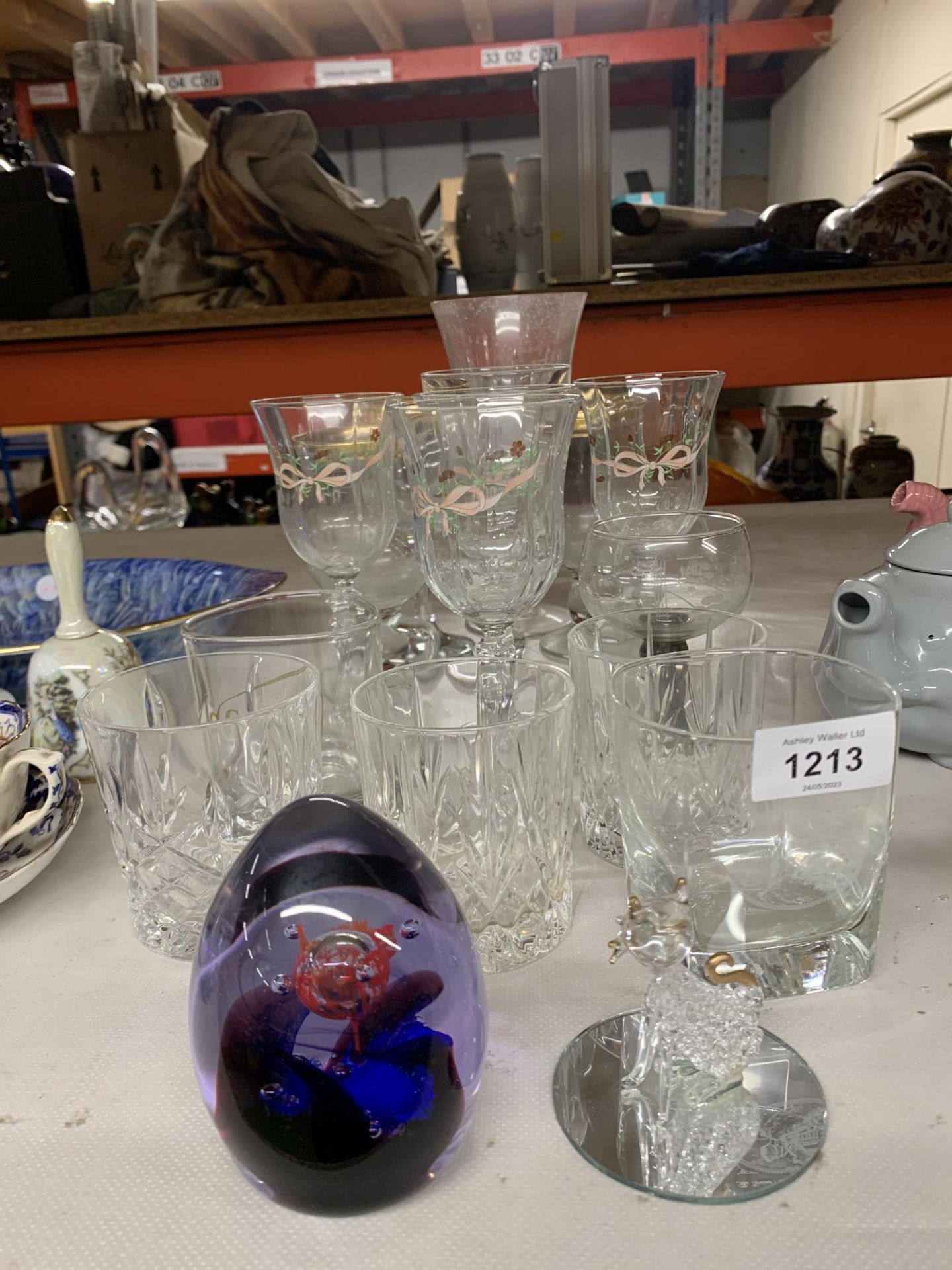 A QUANTITY OF GLASSES TO INCLUDE WINE, TUMBLERS, A PAPERWEIGHT, A CAT, ETC