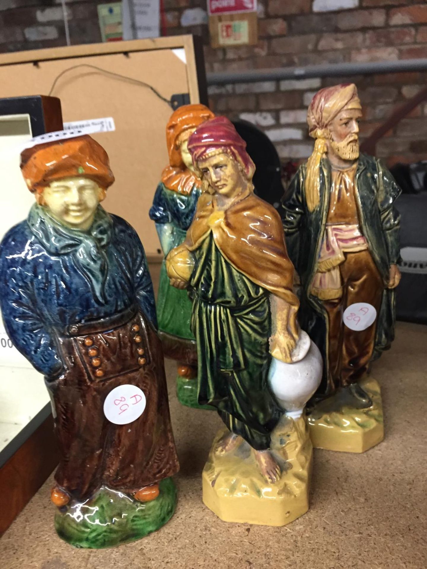 FOUR VINTAGE CONTINENTAL STYLE GLAZED FIGURES