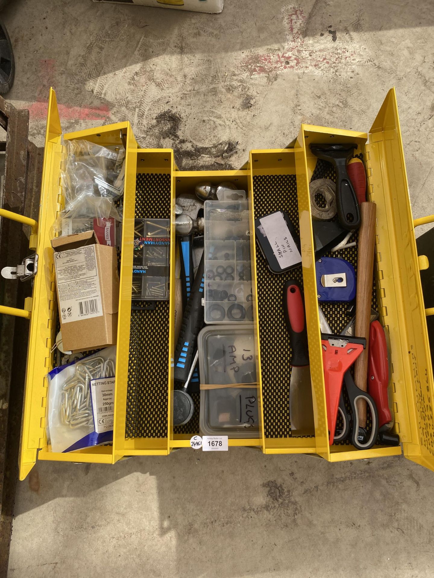 A YELLOW METAL CONCERTINA TOOL CHEST WITH ASSORTED TOOLS