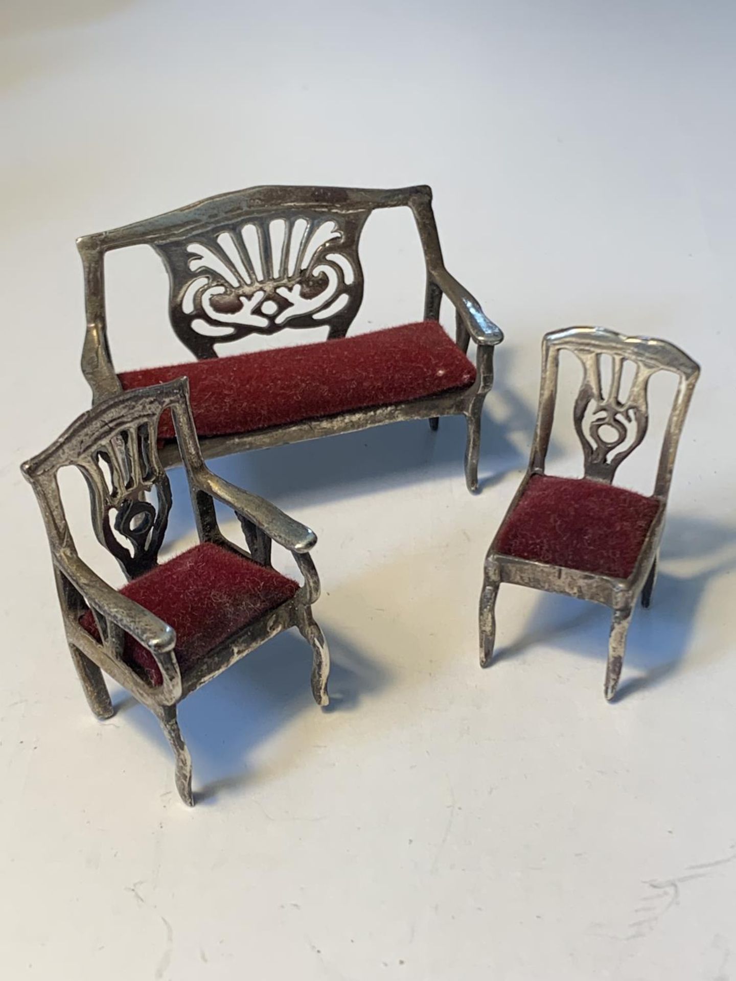 THREE MINIATURE SILVER ITEMS TO INCLUDE A SETTEE, CARVER AND CHAIR