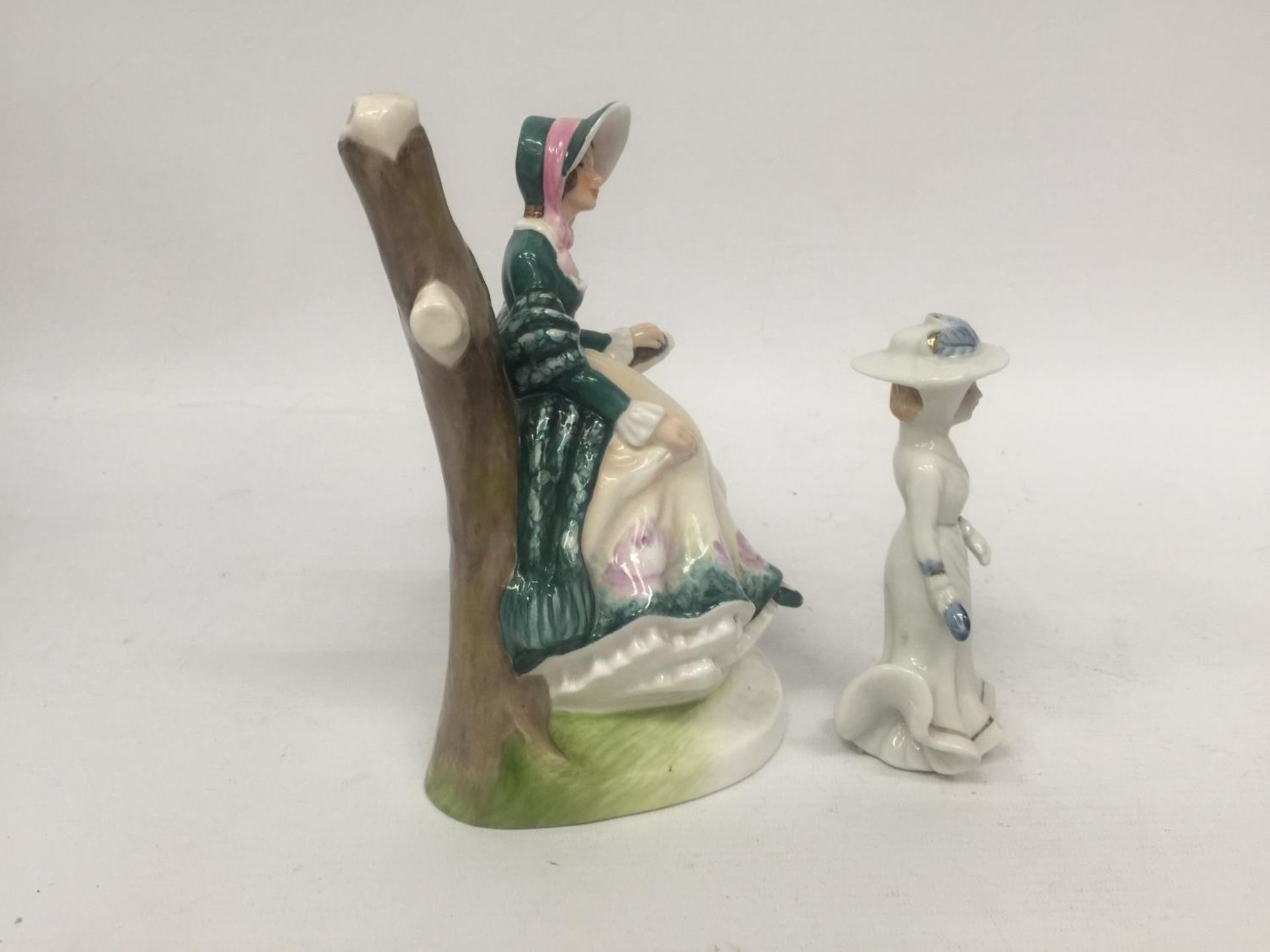 A FINE BONE CHINA FIGURE OF A LADY SITTING IN A BRANCH "EMILY" TOGETHER WITH A SMALL PORCELAIN LADY - Image 2 of 4