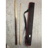 A SNOOKER CUE IN A CASE