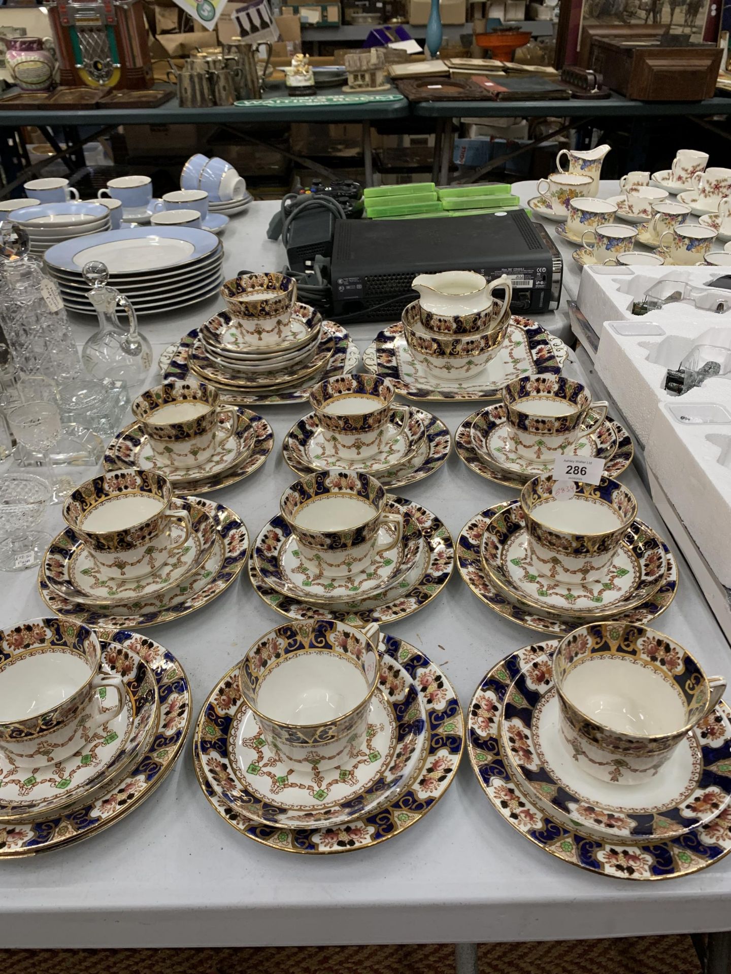 A LARGE EDWARDIAN TEA SET, CUPS, SAUCERS, SIDE PLATES ETC