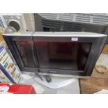 A PANASONIC 26" TELEVISION WITH REMOTE CONTROL