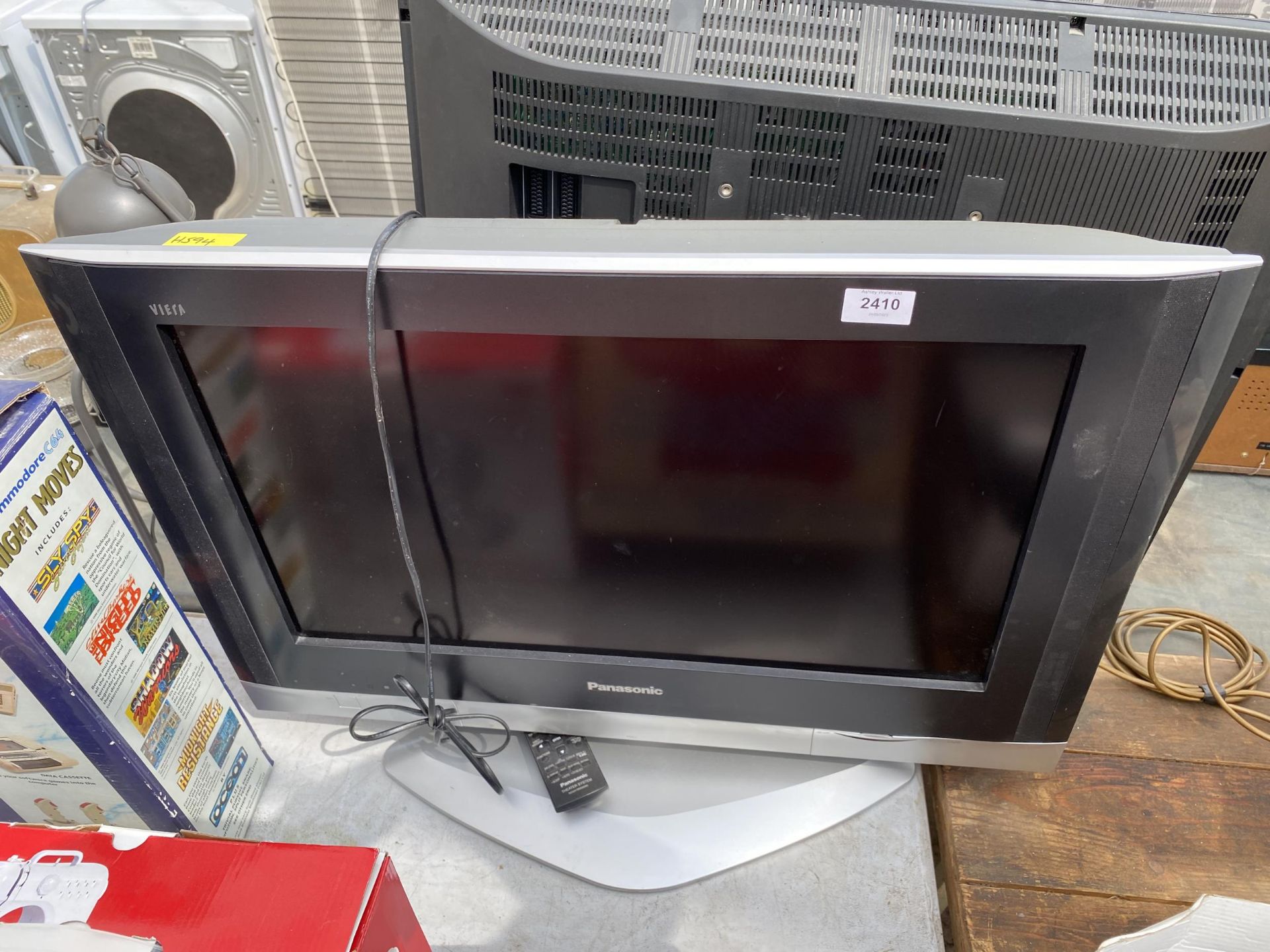A PANASONIC 26" TELEVISION WITH REMOTE CONTROL