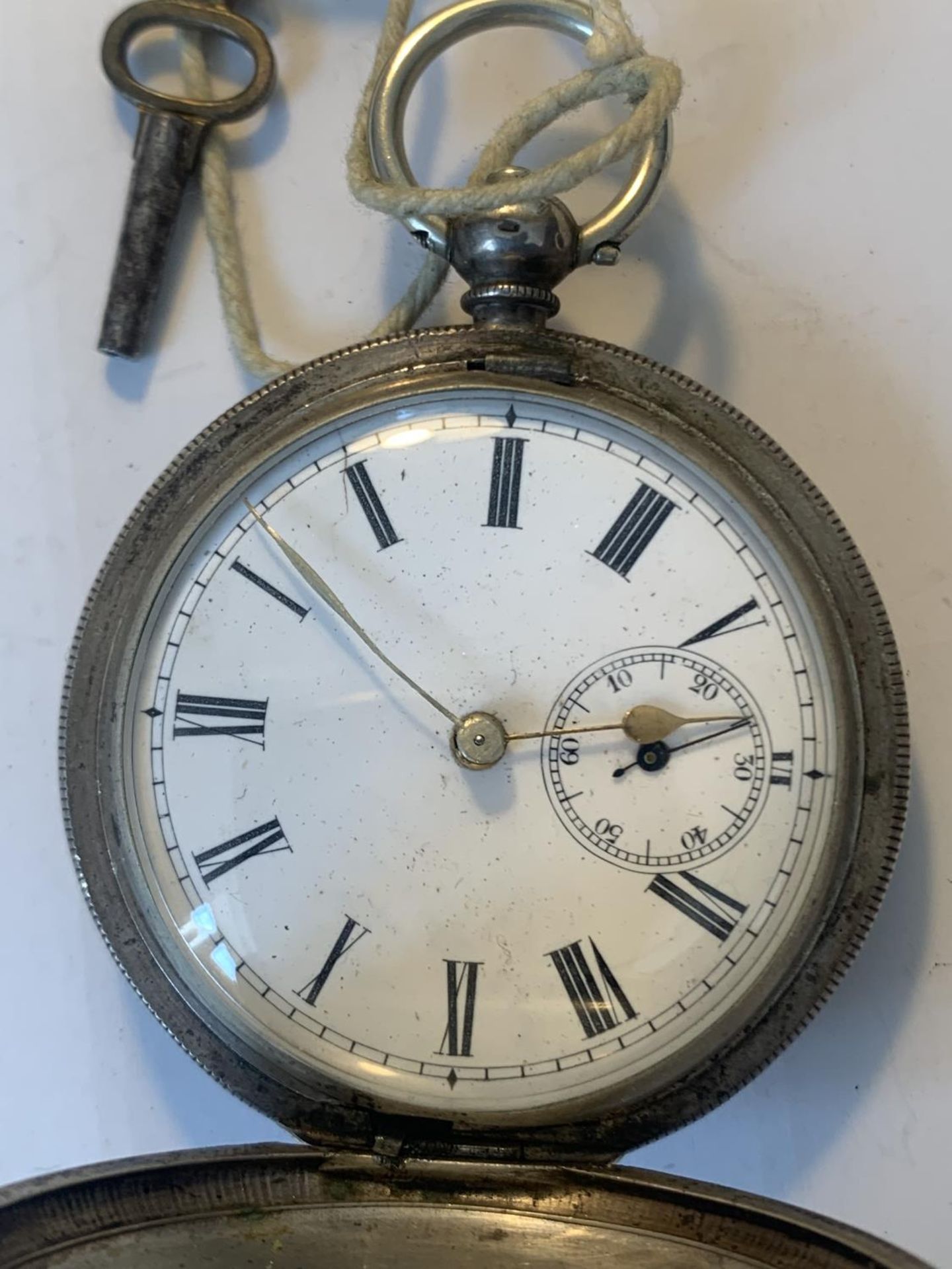 A MARKED 800 SILVER POCKET WATCH WITH WHITE ENAMEL FACE, ROMAN NUMERALS, SUB DIAL AND KEY - Image 2 of 5