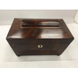 A VICTORIAN MAHOGANY TEA CADDY WITH TWO INNER COMPARTMENTS