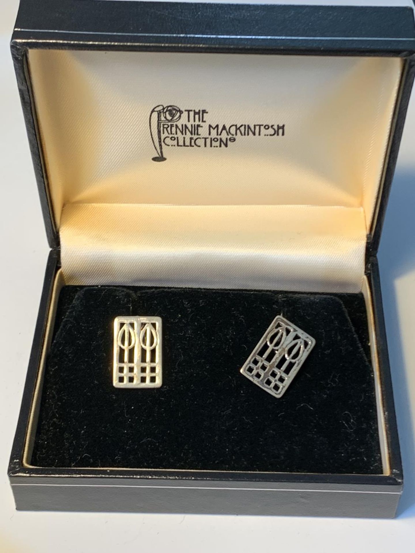 A PAIR OF RENNIE MACKINTOSCH STYLE CUFFLINKS IN A PRESENTATION BOX