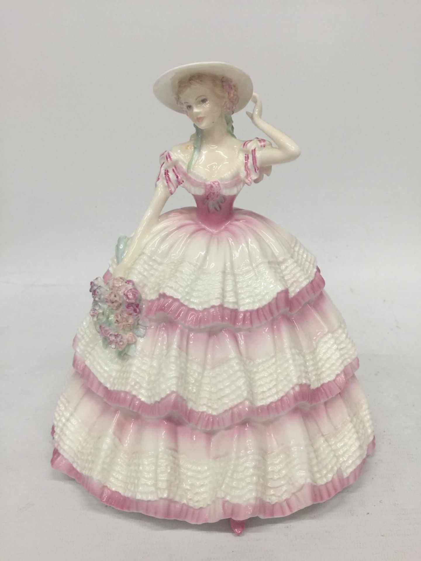 A STUNNING COALPORT FIGURINE FROM THE FOUR FLOWERS COLLECTION SCULTPED BY JACK GLYNN AND BEING A