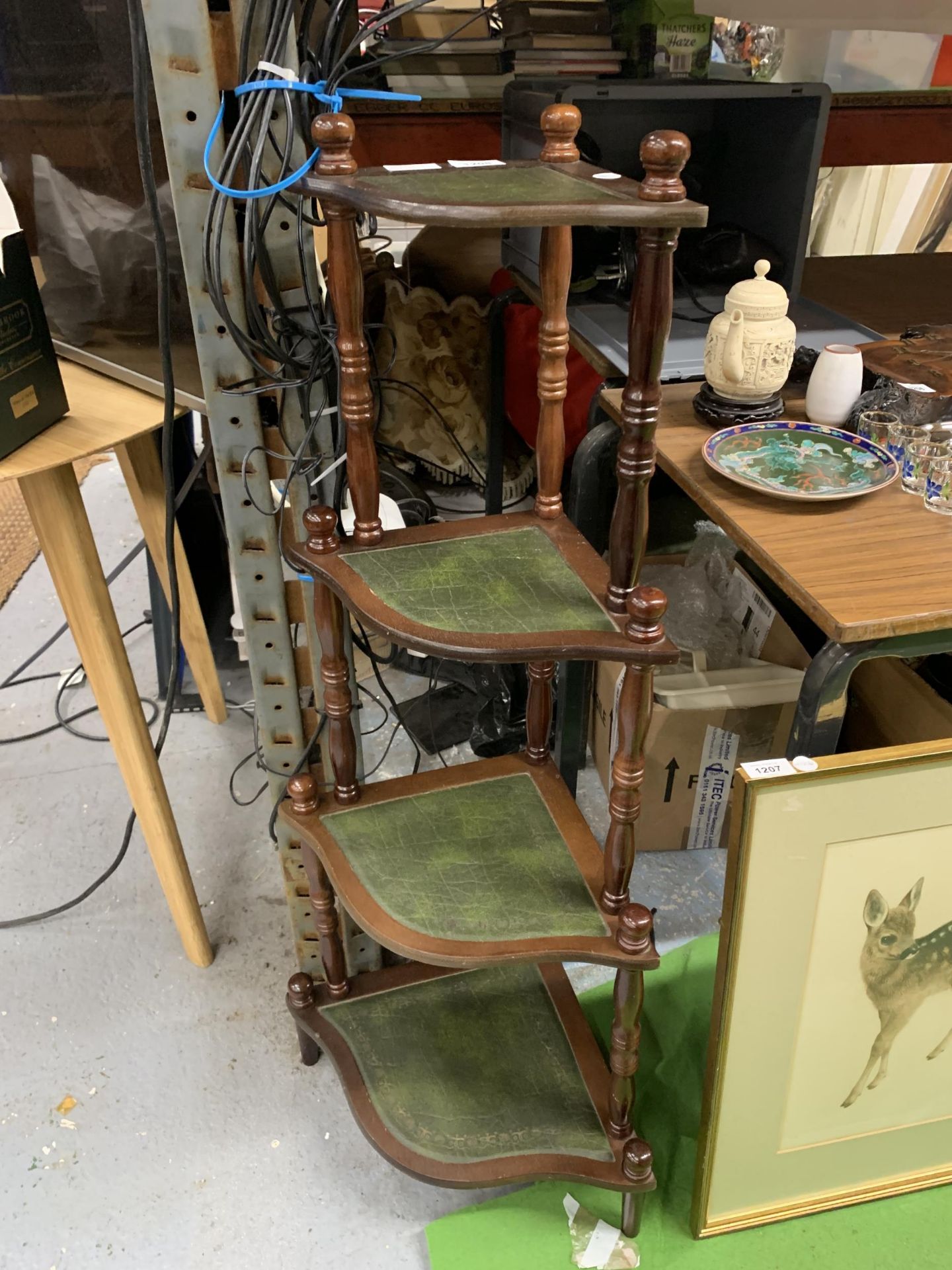 A VINTAGE MAHOGANY AND GREEN LEATHER FOUR TIER WHATNOT STAND