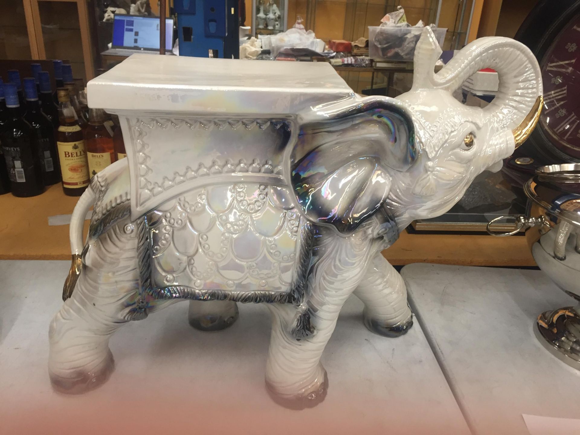 A DECORATIVE CERAMIC GARDEN ELEPHANT SEAT WITH PEARLESCENT DESIGN AND GILT HIGHLIGHTS, HEIGHT 48CM