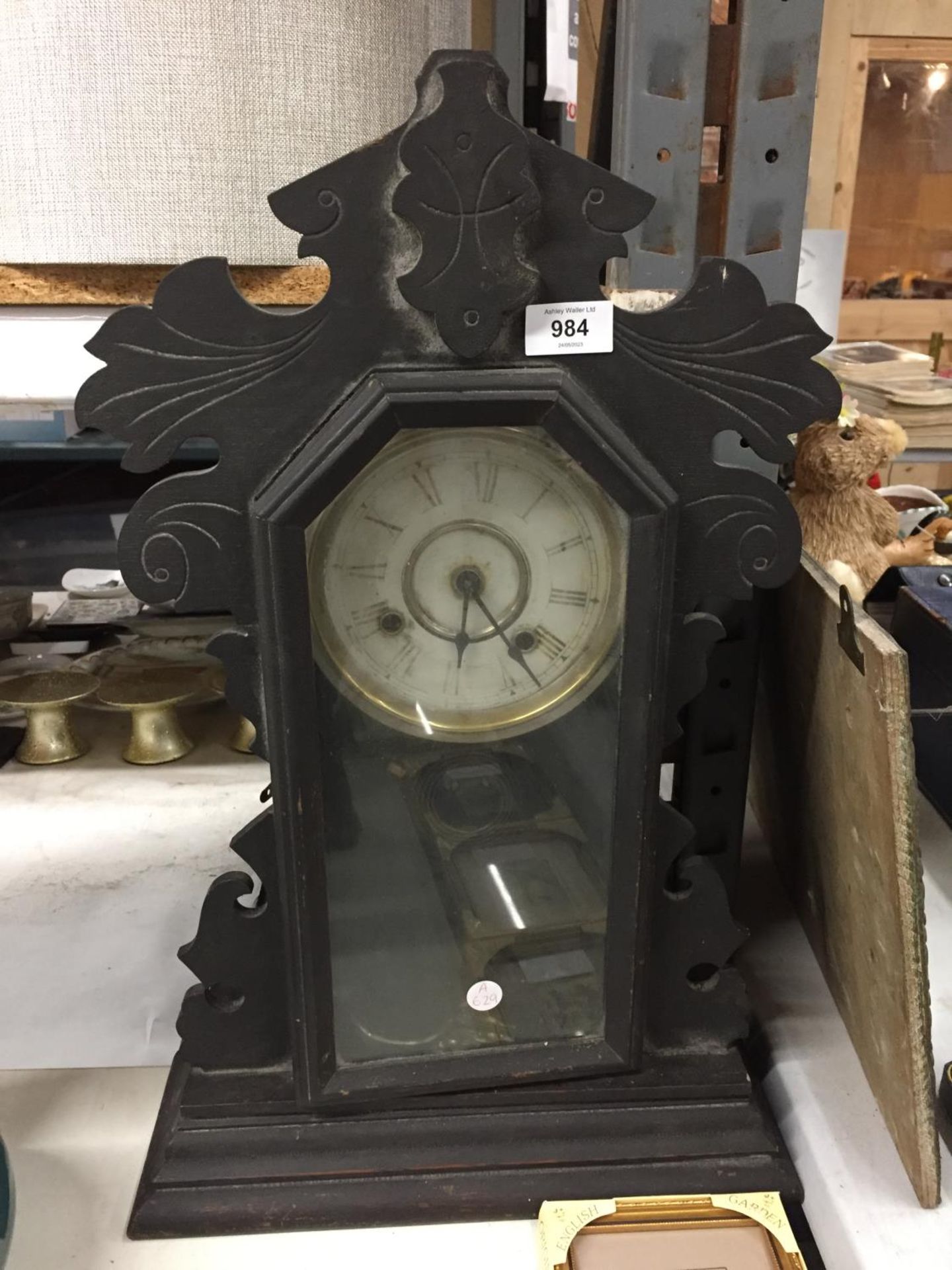 A VINTAGE WOODEN CASED WALL CLOCK WITH PENDULUM - IN NEED OF RESTORATION