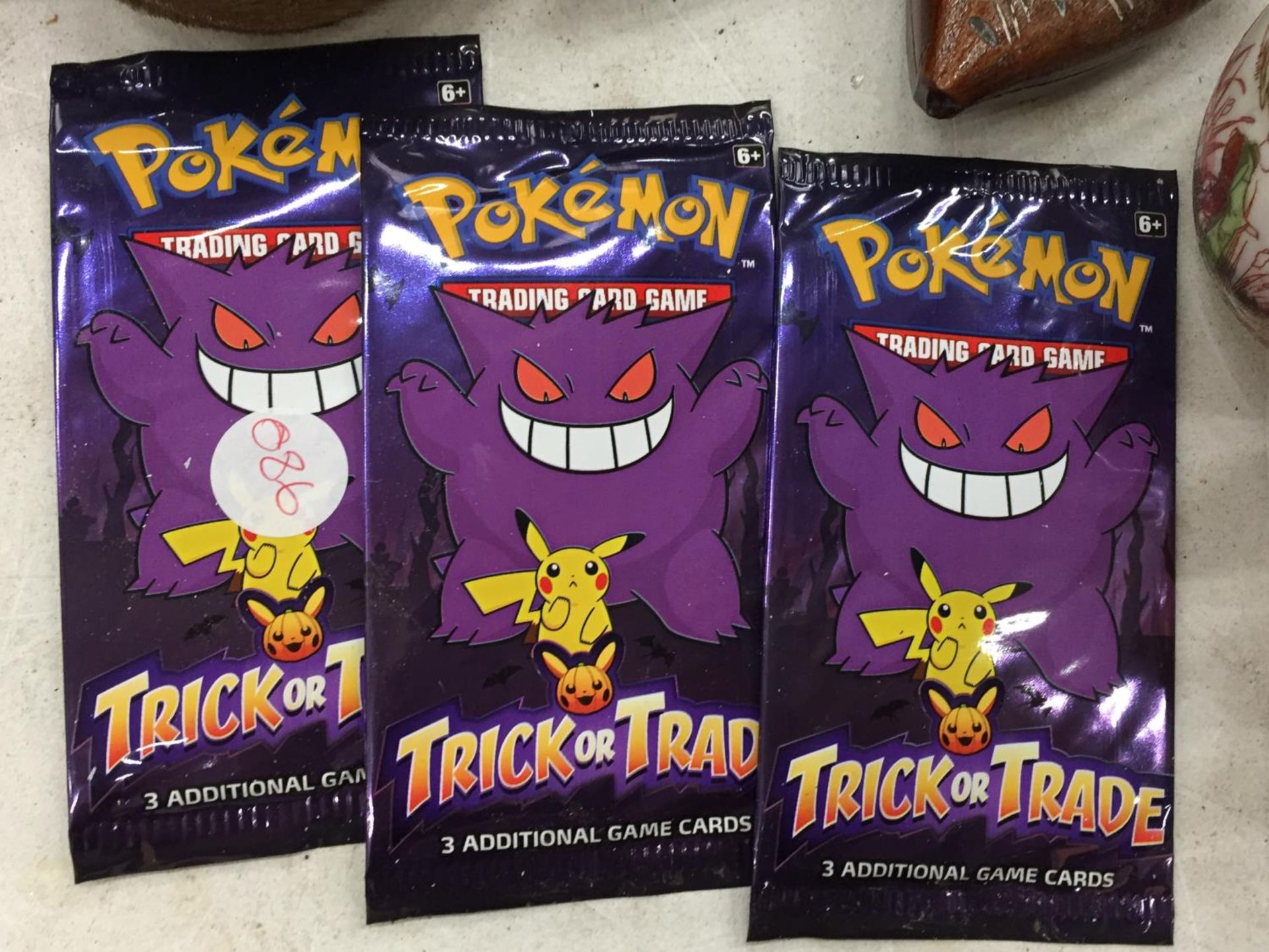 THREE PACKETS OF USA EXCLUSIVE TRICK OR TRADE UNOPENED BOOSTER PACKS