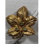 A 9 CARAT GOLD MAPLE LEAF BROOCH WITH THREE STONES GROSS WEIGHT 4 GRAMS