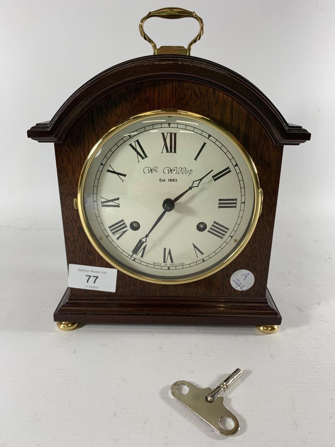 * A PRESENTATION MANTLE CLOCK BY WM WIDDOP, HEIGHT 25CM, PRESENTED BY G.M.P A DIVISION 1991