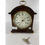 * A PRESENTATION MANTLE CLOCK BY WM WIDDOP, HEIGHT 25CM, PRESENTED BY G.M.P A DIVISION 1991