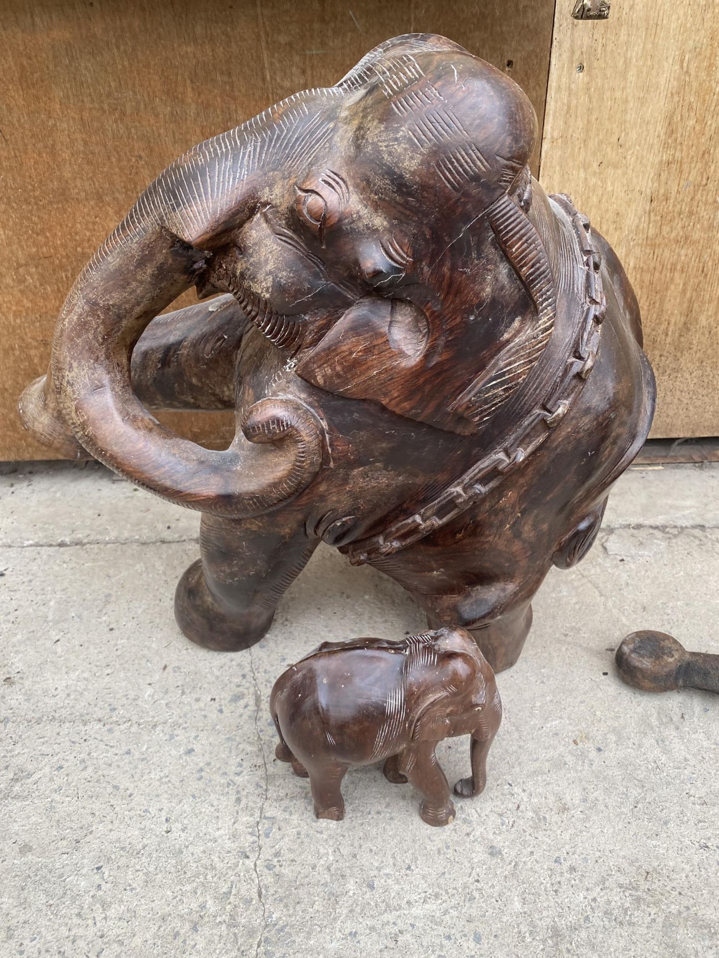 A HEAVY WOODEN ELEPHANT (H:49CM) AND A FURTHER SMALL WOODEN ELEPHANT