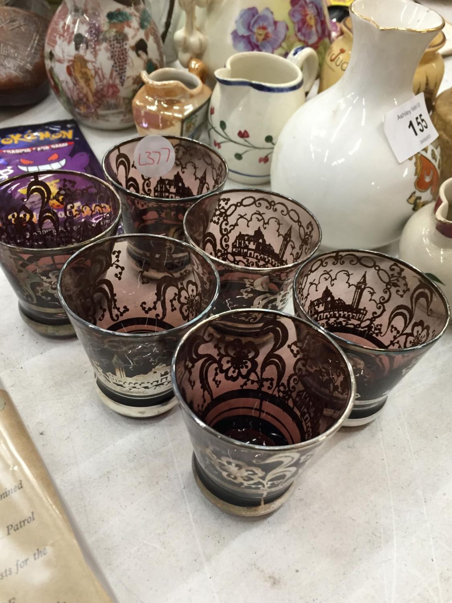 A SET OF SIX GLASSES OVERLAID IN SILVER