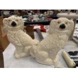 A PAIR OF VINTAGE STAFFORDSHIRE SPANIELS