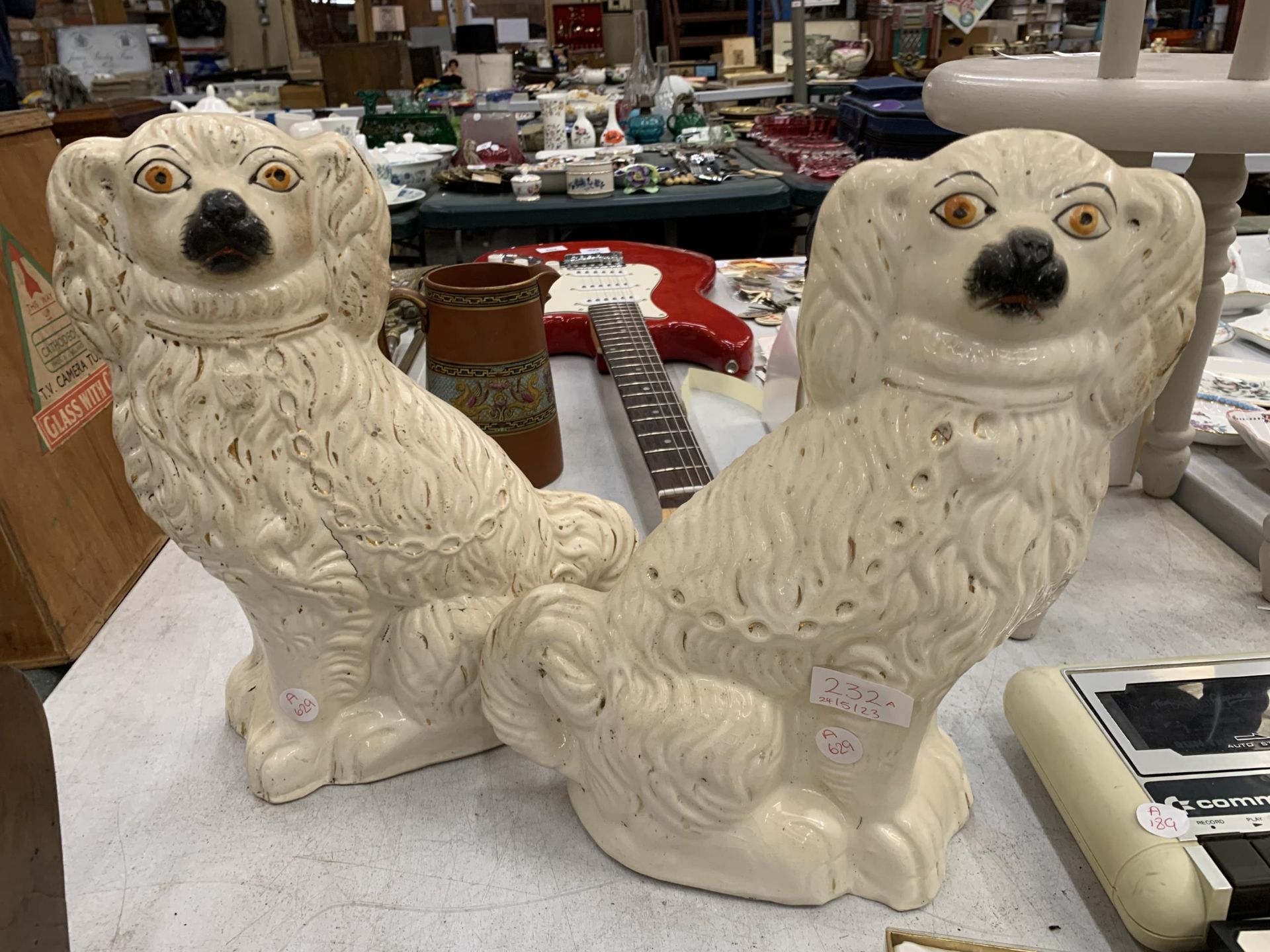 A PAIR OF VINTAGE STAFFORDSHIRE SPANIELS