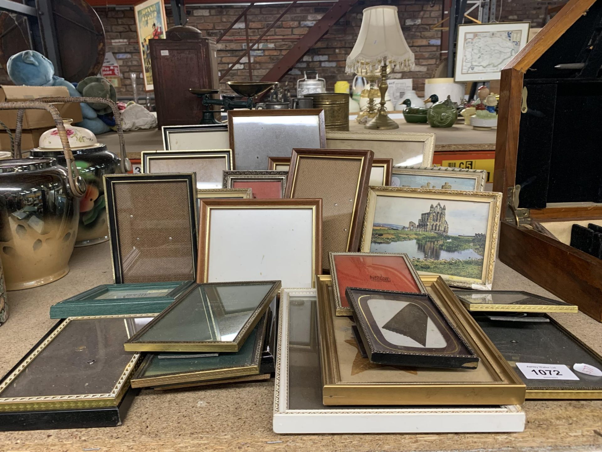 A COLLECTION OF ASSORTED PHOTO FRAMES