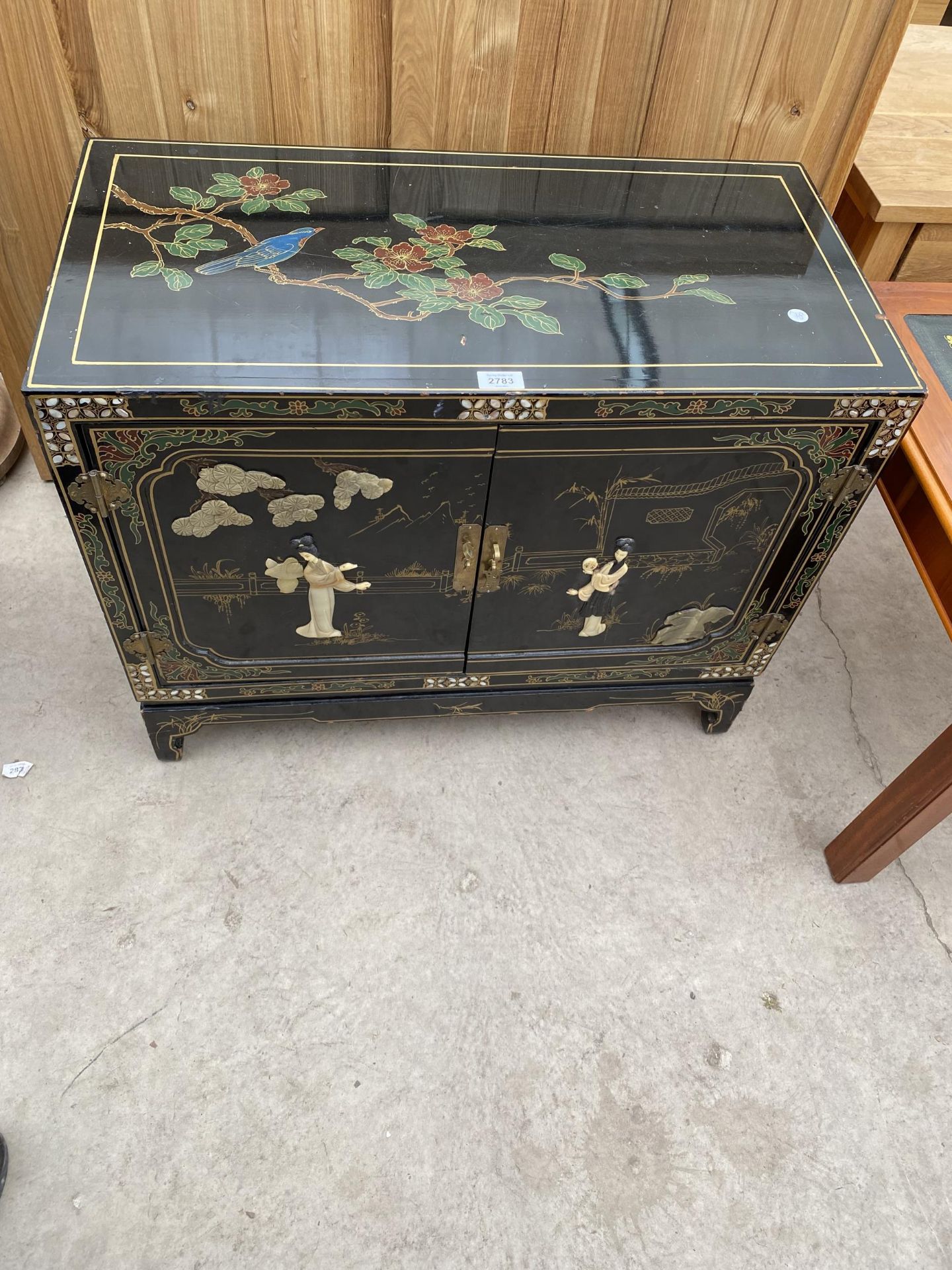 A MODERN TWO DOOR SIDE CABINET WITH APPLIED AND PAINTED CHINOISERIE DECORATION, 30" WIDE