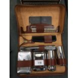 A LEATHER CASED GENTLEMAN'S GROOMING KIT