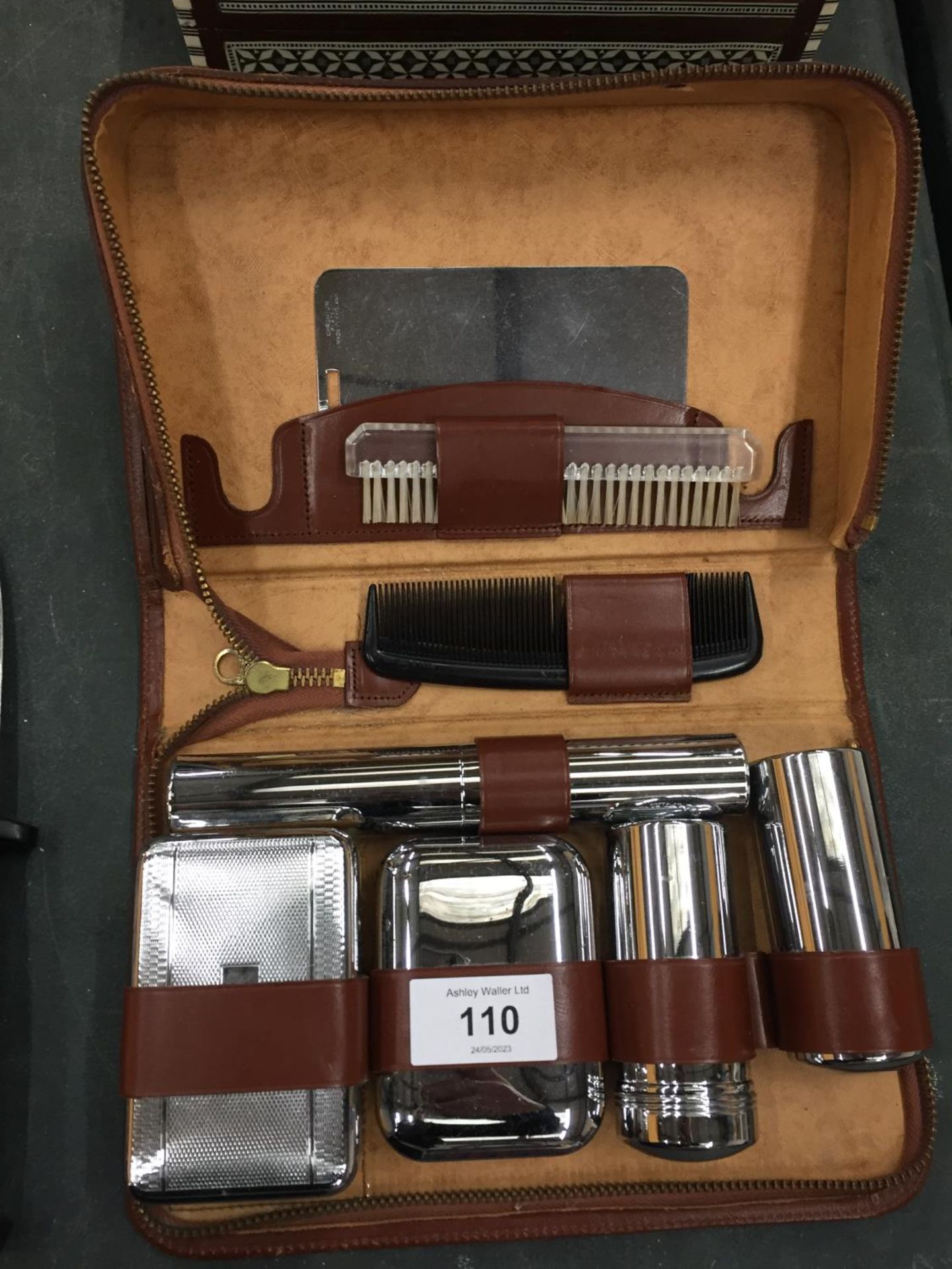 A LEATHER CASED GENTLEMAN'S GROOMING KIT
