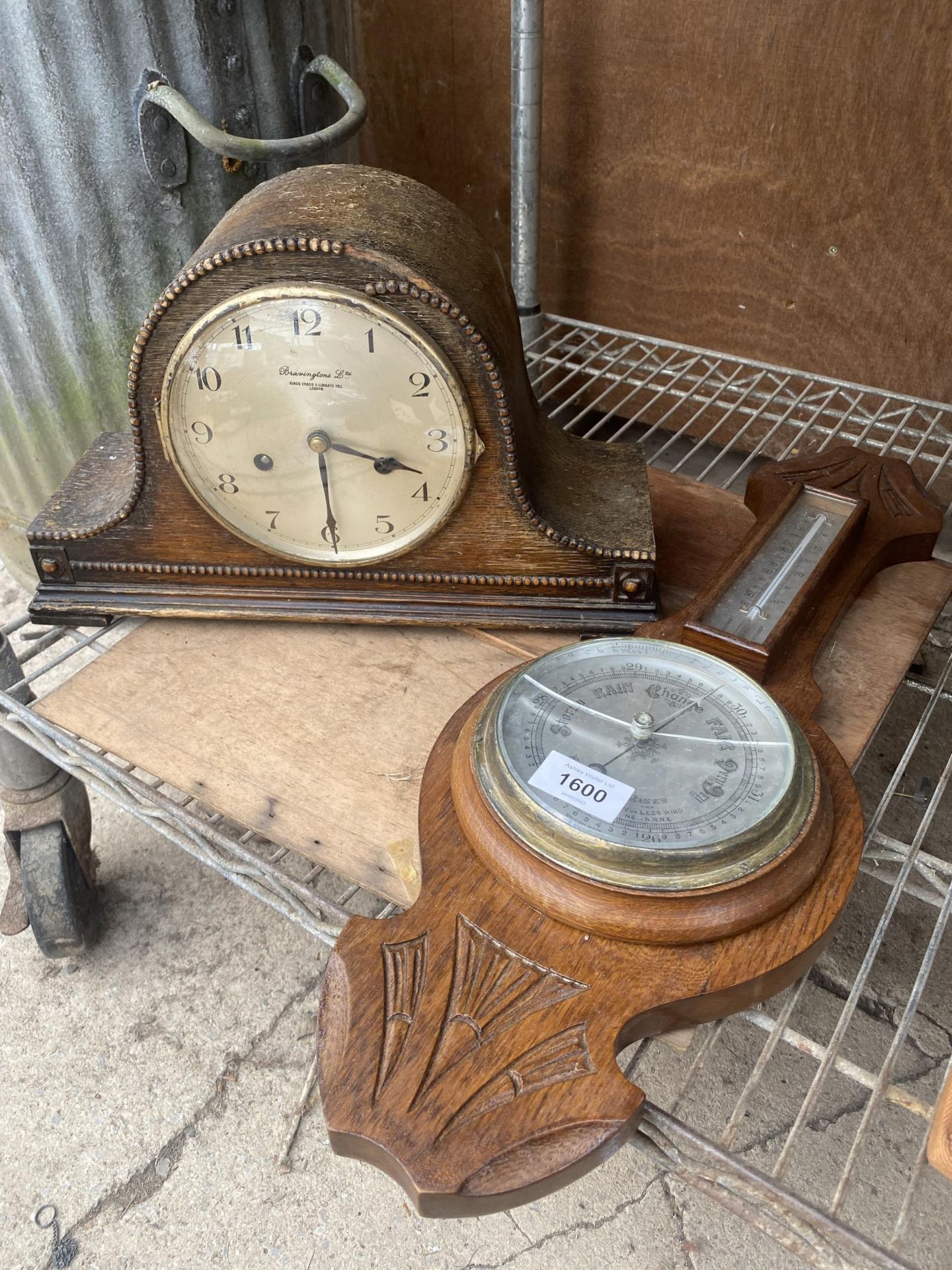 A VINTAGE WOODEN CASED BAROMETER AND A MANTLE CLOCK