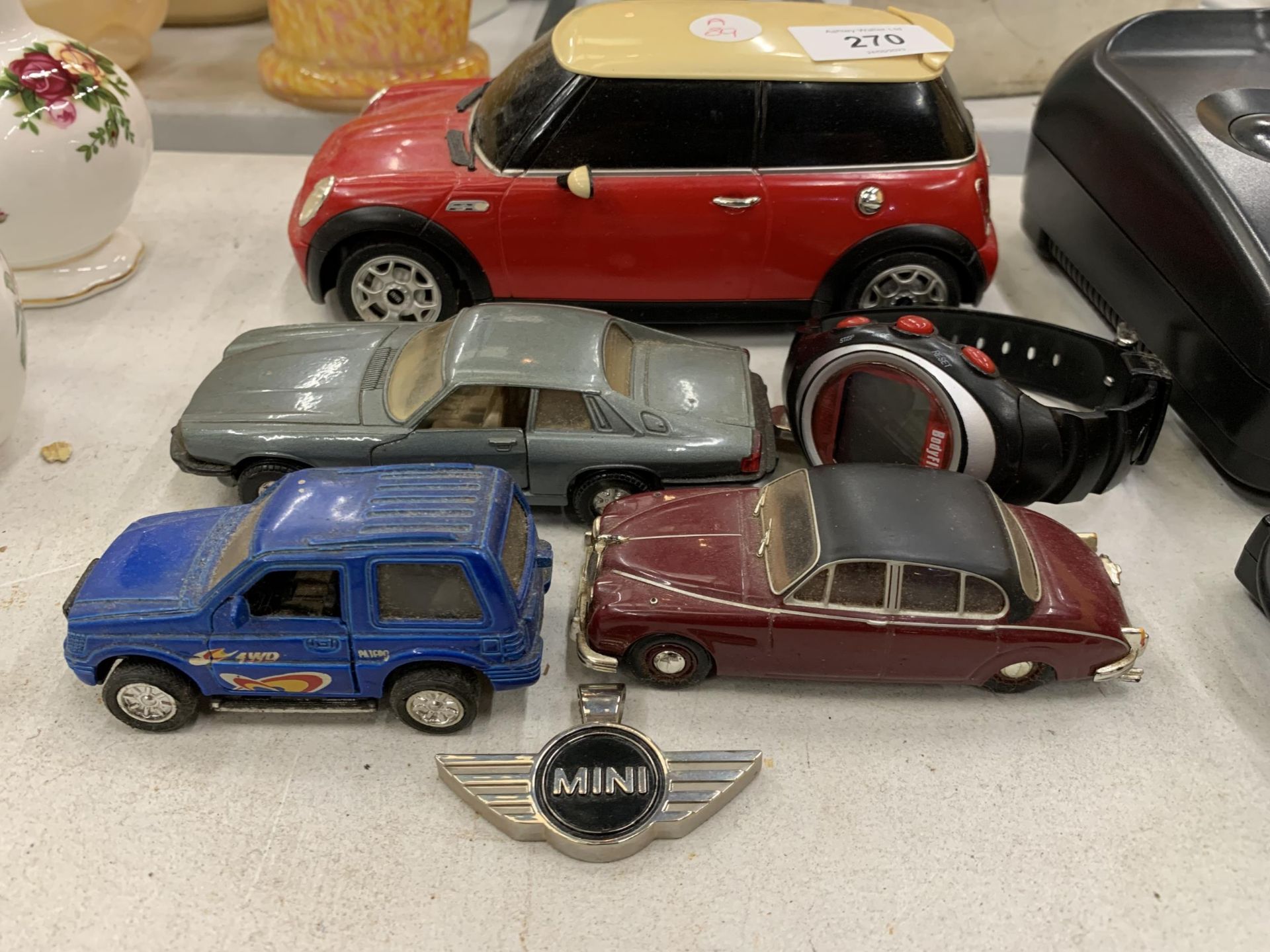 A GROUP OF CAR TOYS, DIECAST EXAMPLES, MINI BADGE ETC